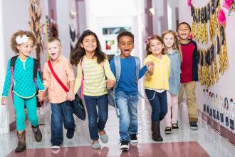 
		Children running through a hallway
	